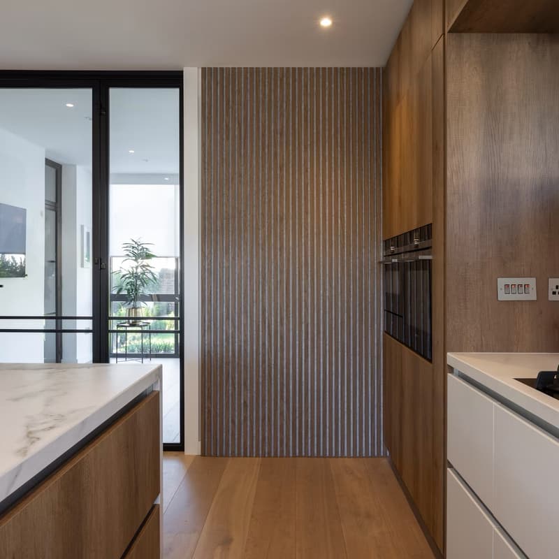 Oak slat wall with built-in cabinetry